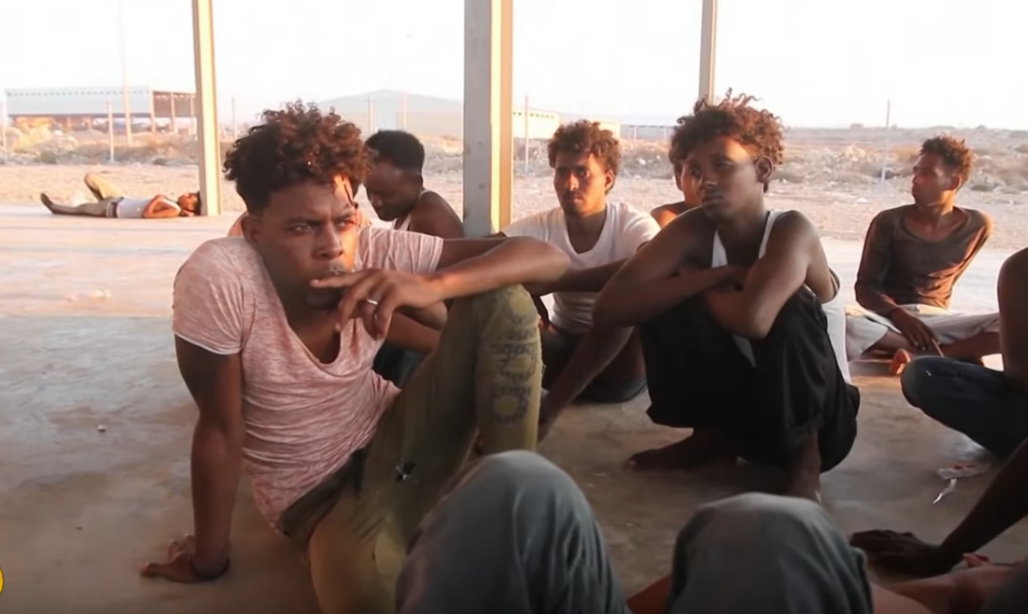 Libya to close migrant centres after criticism from UN
